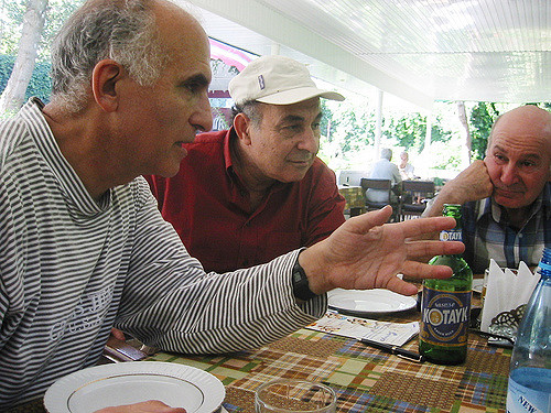 Haig and Garbis listening to Antoine T- while we wait for lunch at a restaurant in Yerevan.